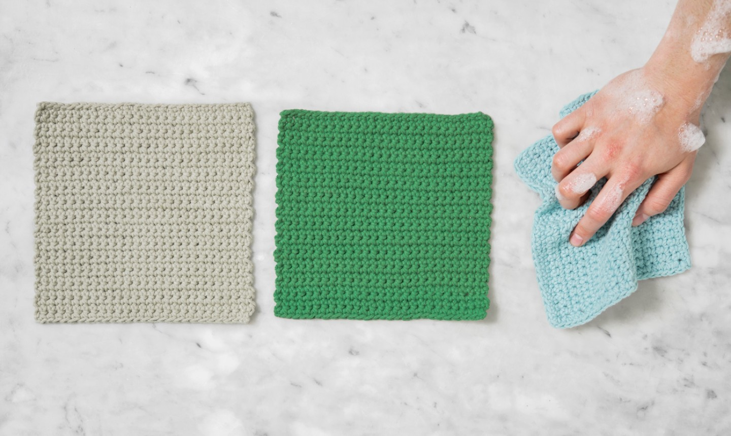 single crochet dishcloths with a soapy hand