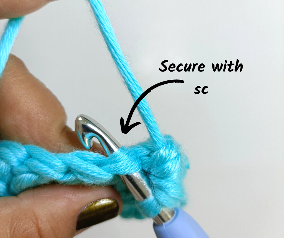 Bobble Stitch Pop - securing your bobble stitch by creating a sc in the next stitch