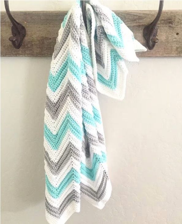 Single Crochet Chevron Blanket hanging on a hook