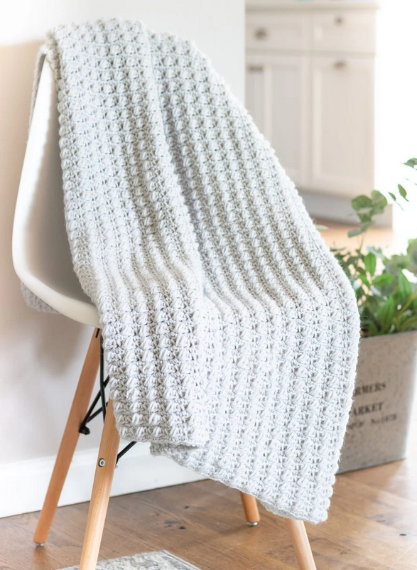light gray Textured Puff Stitch Blanket on a chair